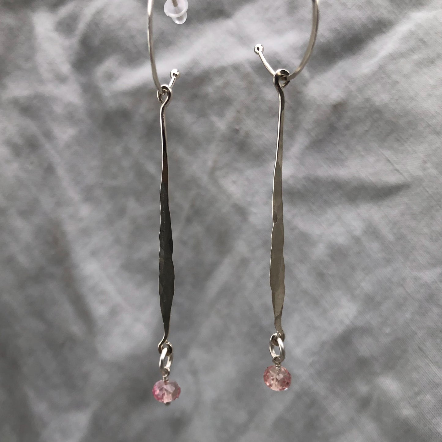 Hammered drop earrings in argentium sterling silver with microfaceted pink sapphires // Kinetic sculptural September birthstone earrings