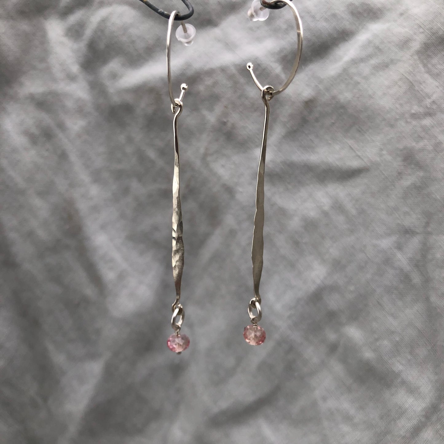 Hammered drop earrings in argentium sterling silver with microfaceted pink sapphires // Kinetic sculptural September birthstone earrings