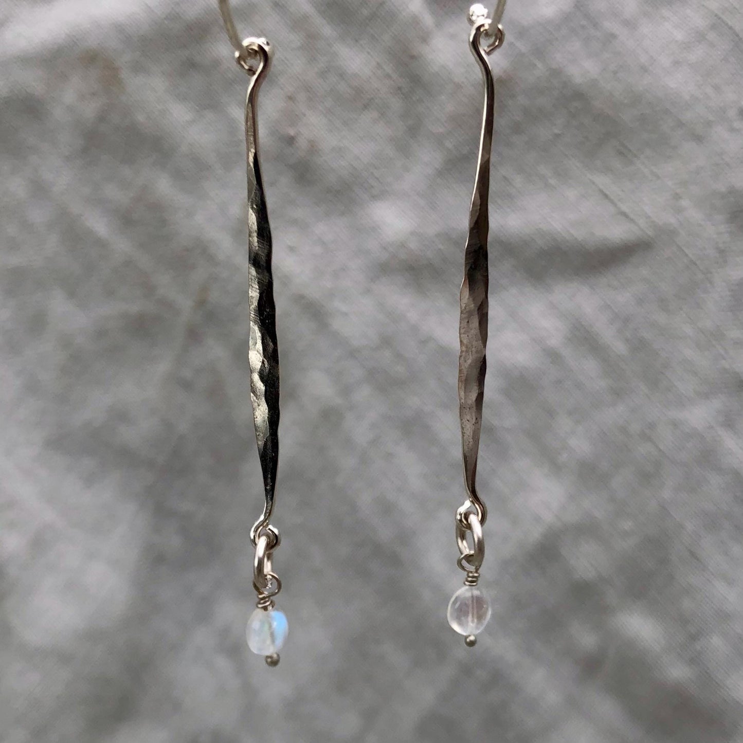 Hammered drop earrings in argentium sterling silver with moonstone // Kinetic sculptural earrings // June birthstone earrings