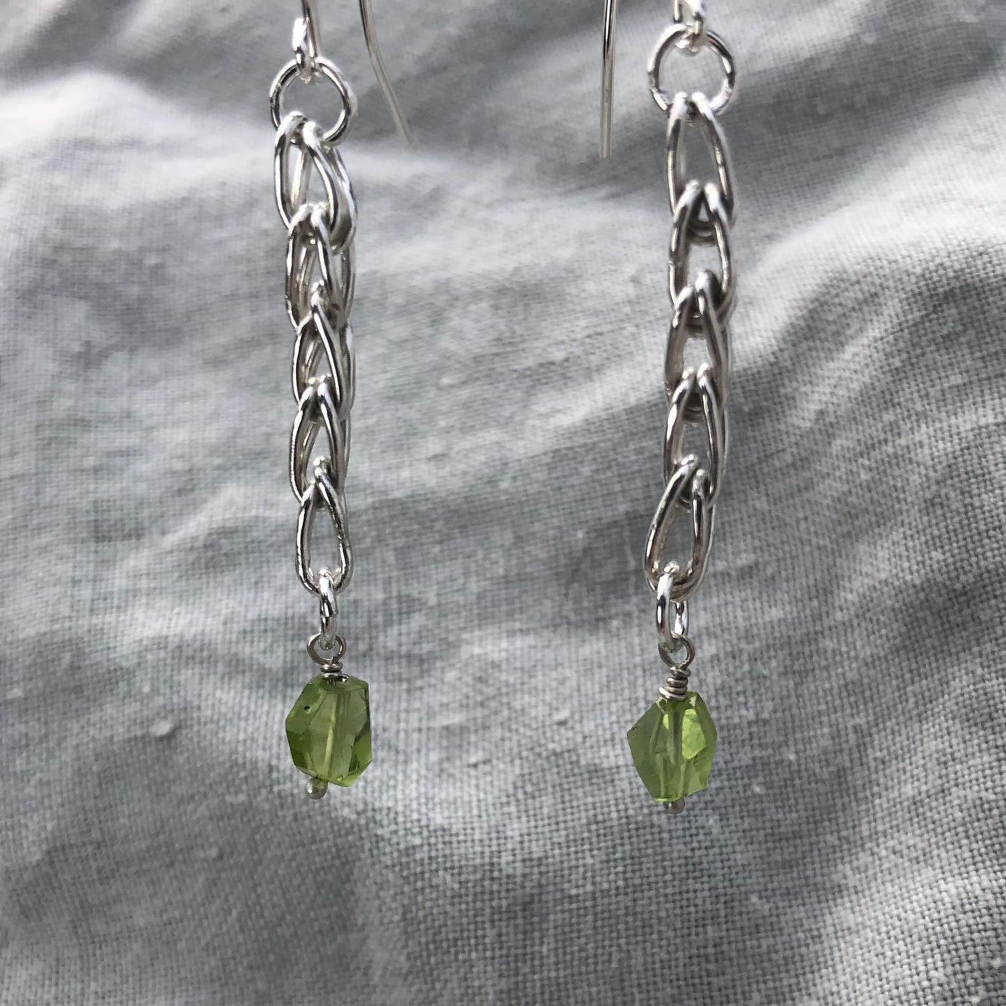 Loop-in-loop earrings in argentium sterling silver with geometric apple-green Arizona peridot