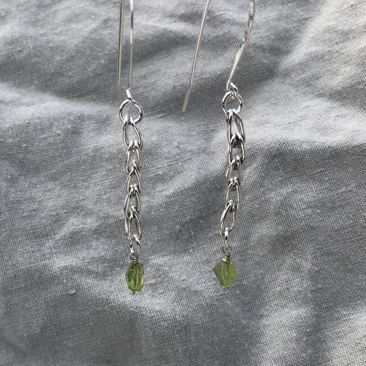 Loop-in-loop earrings in argentium sterling silver with geometric apple-green Arizona peridot