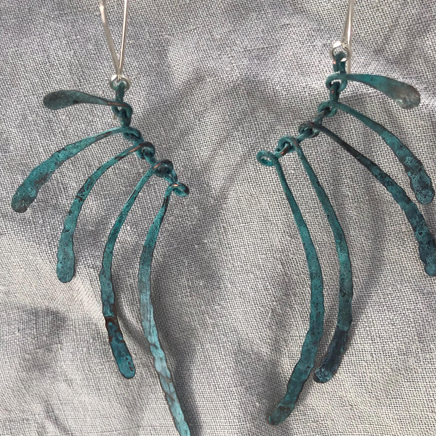 Bare bones earrings in copper with blue-green verdigris patina