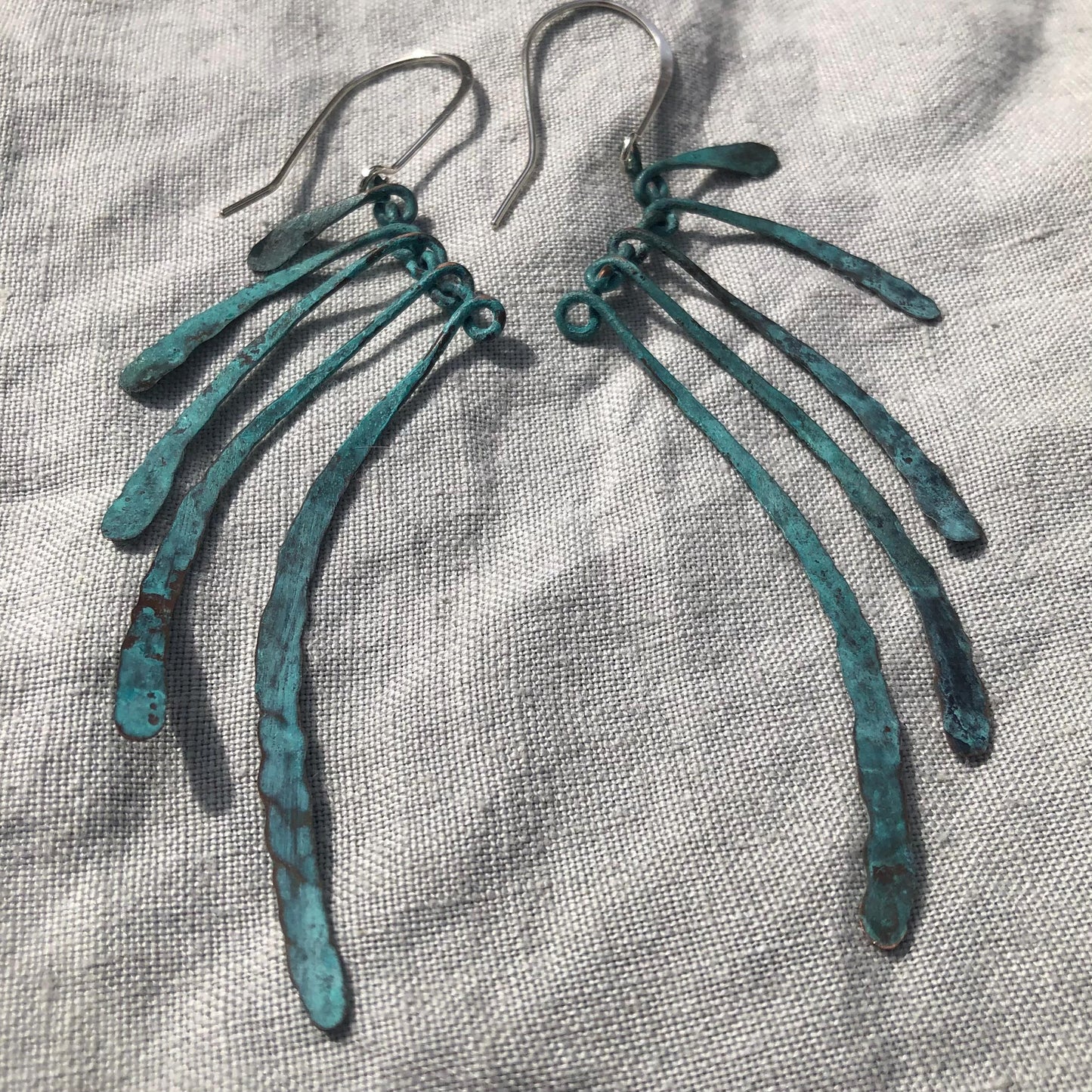 Bare bones earrings in copper with blue-green verdigris patina