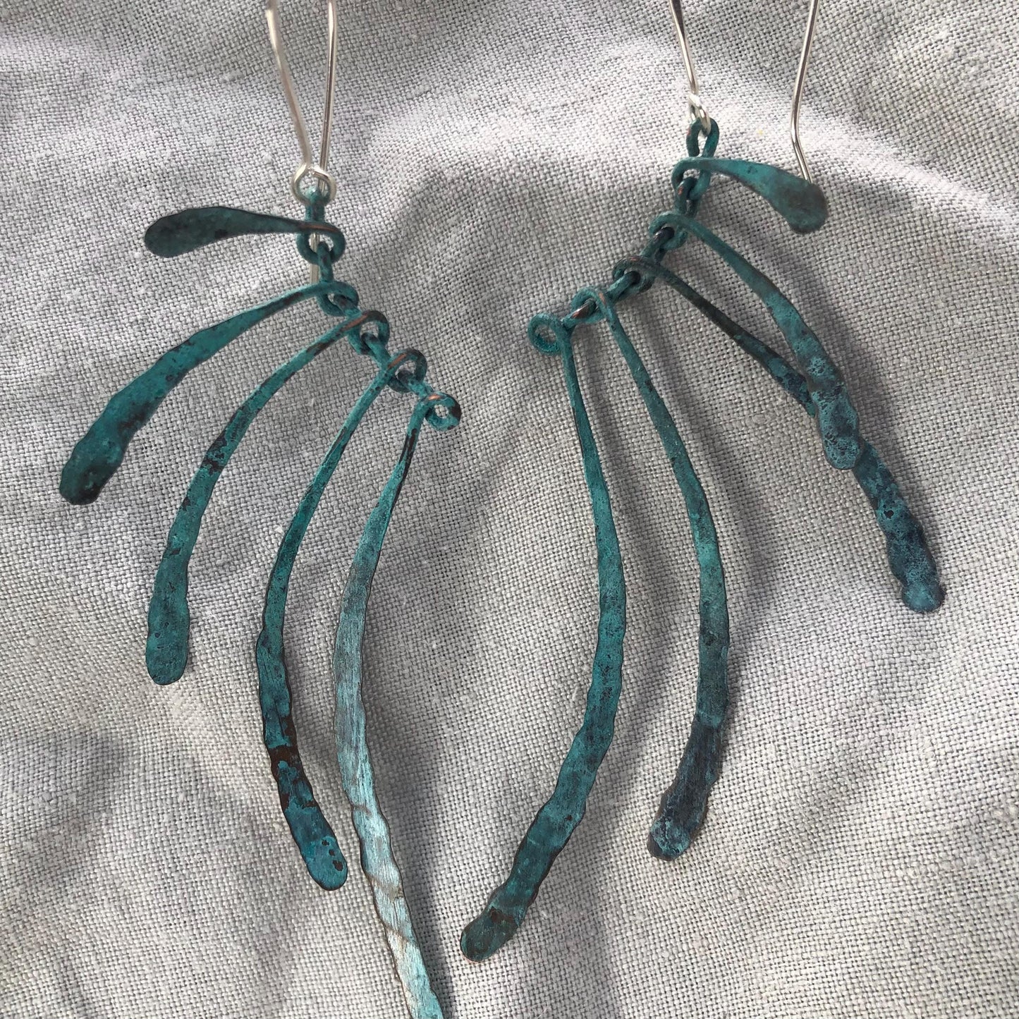 Bare bones earrings in copper with blue-green verdigris patina