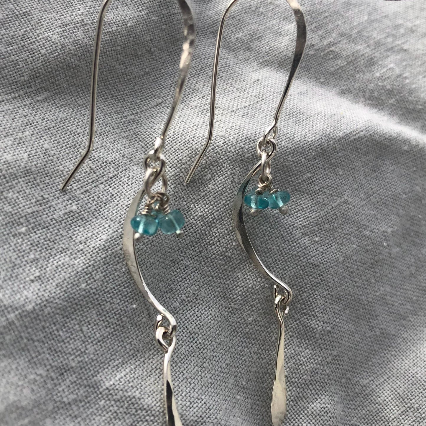 C-curve earrings in argentium sterling silver with bright blue apatite