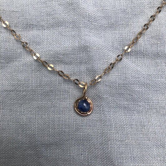 Natural blue sapphire cabochon pendant in solid 14 karat gold