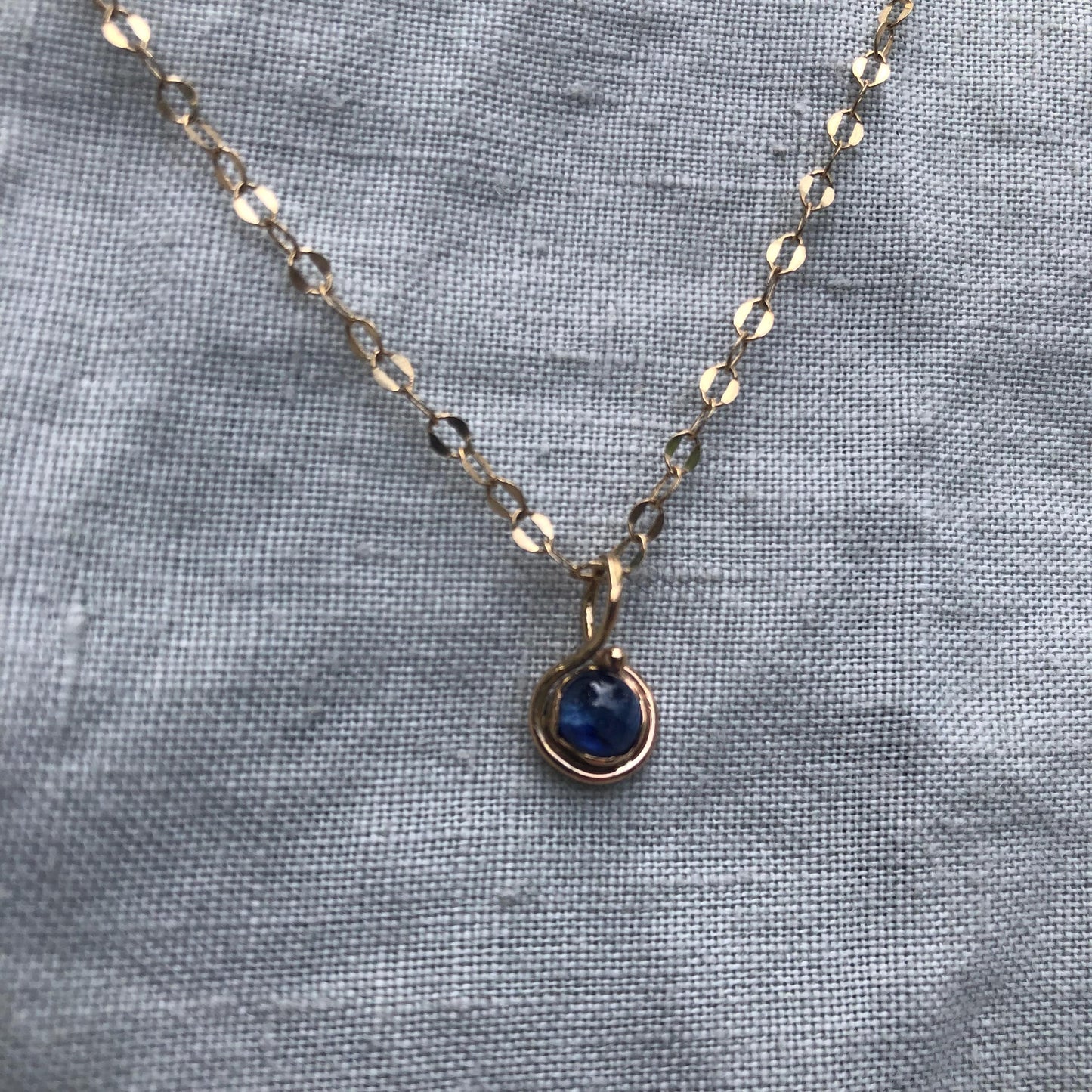 Natural blue sapphire cabochon pendant in solid 14 karat gold