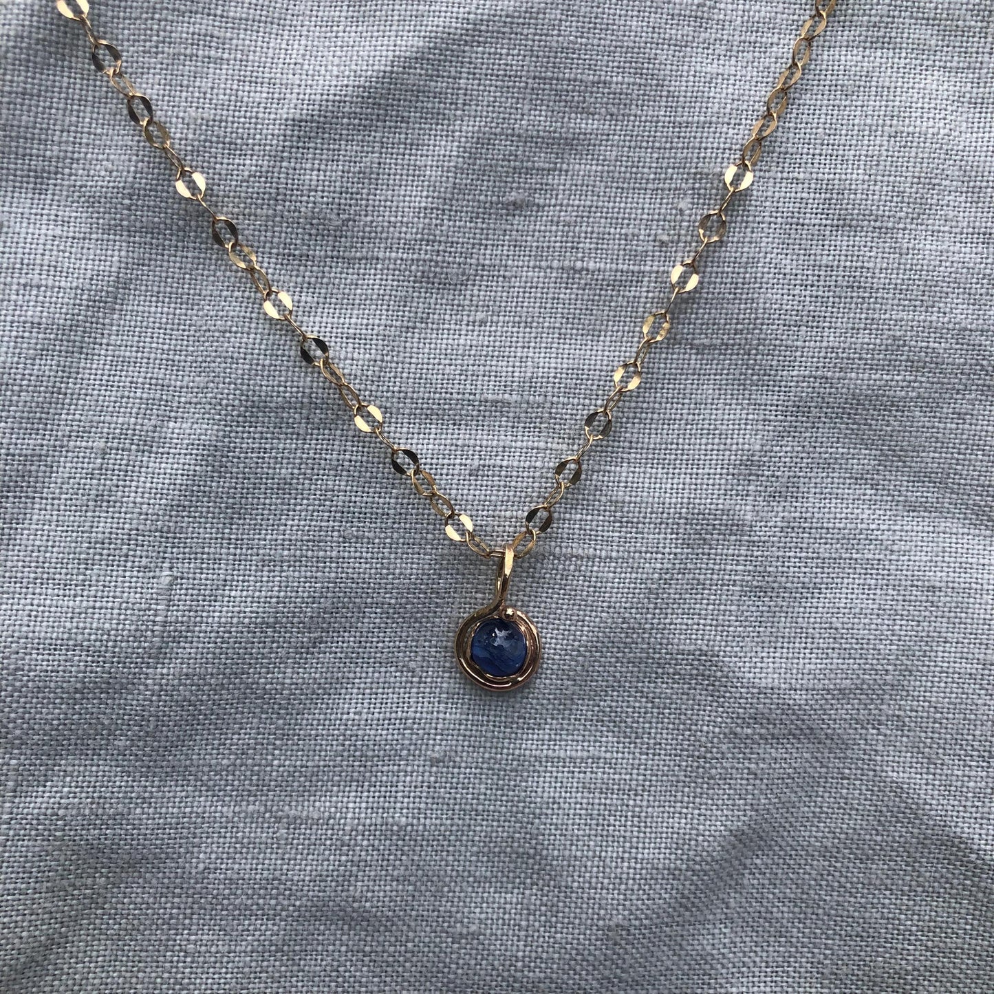 Natural blue sapphire cabochon pendant in solid 14 karat gold