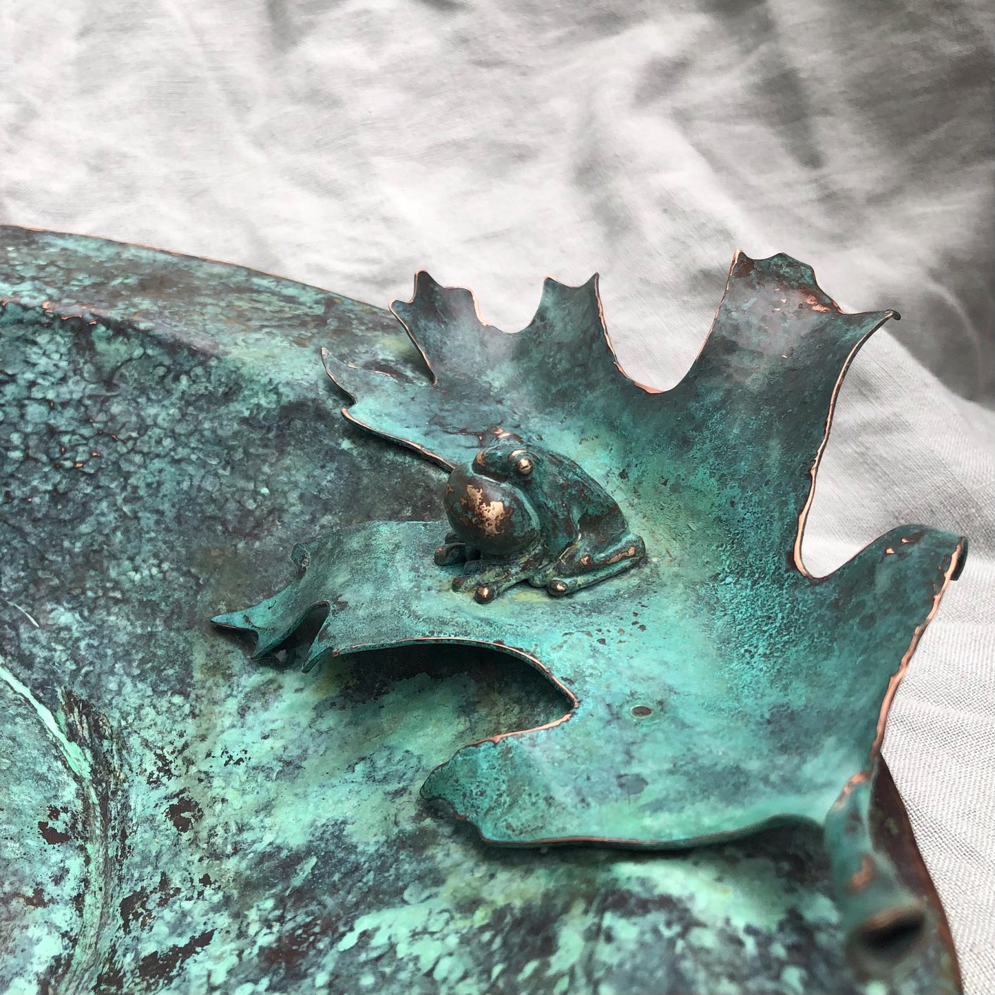 Vernal pool bowl with spring peeper frogs and oak leaves in copper and bronze with verdigris patina