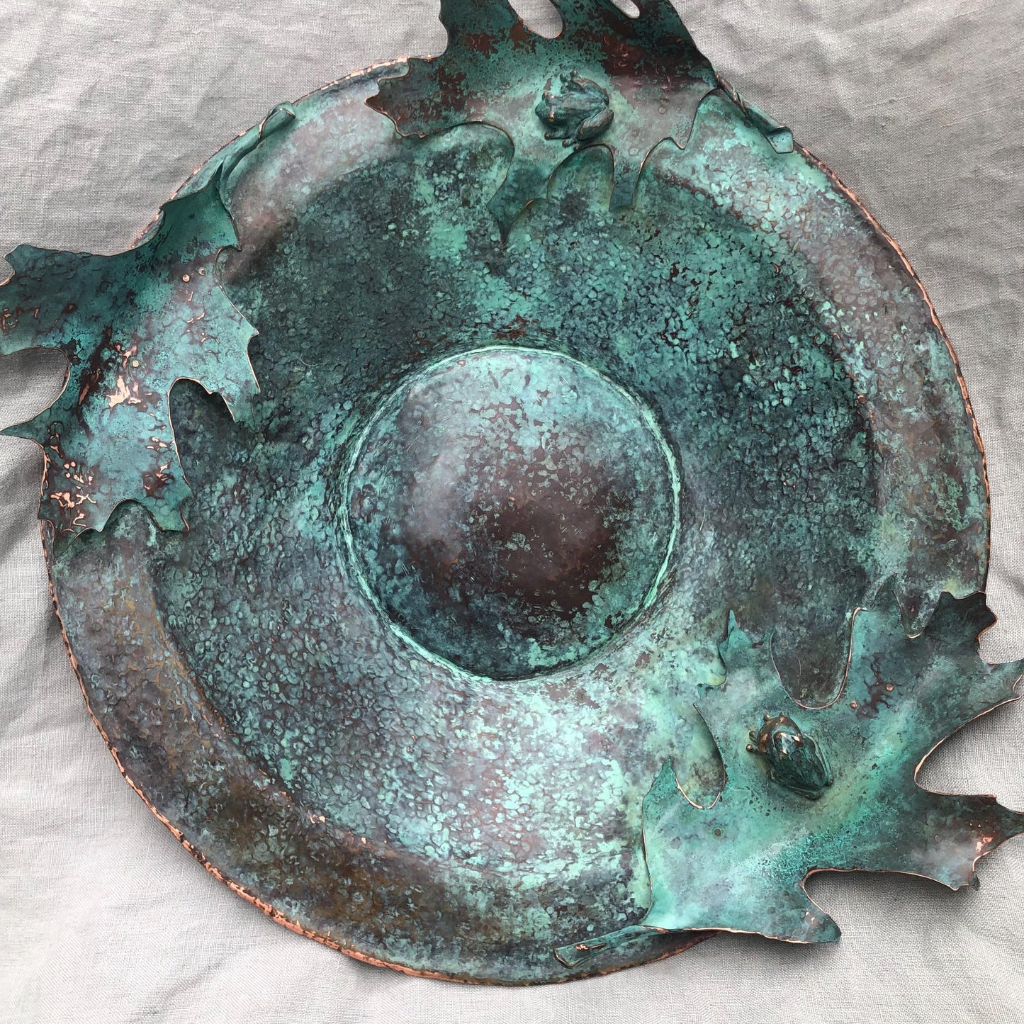 Vernal pool bowl with spring peeper frogs and oak leaves in copper and bronze with verdigris patina
