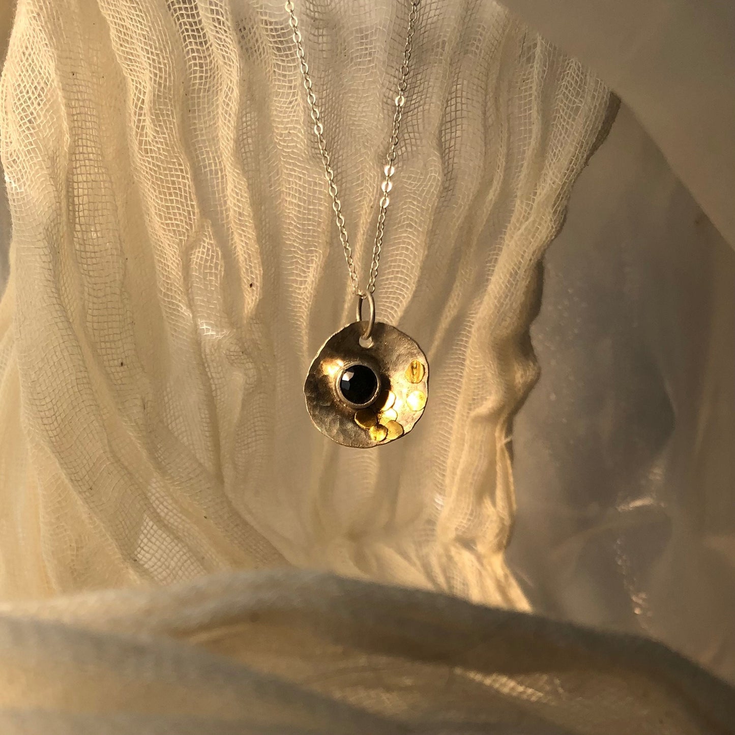 Sapphire pendant in argentium silver and 24 karat gold