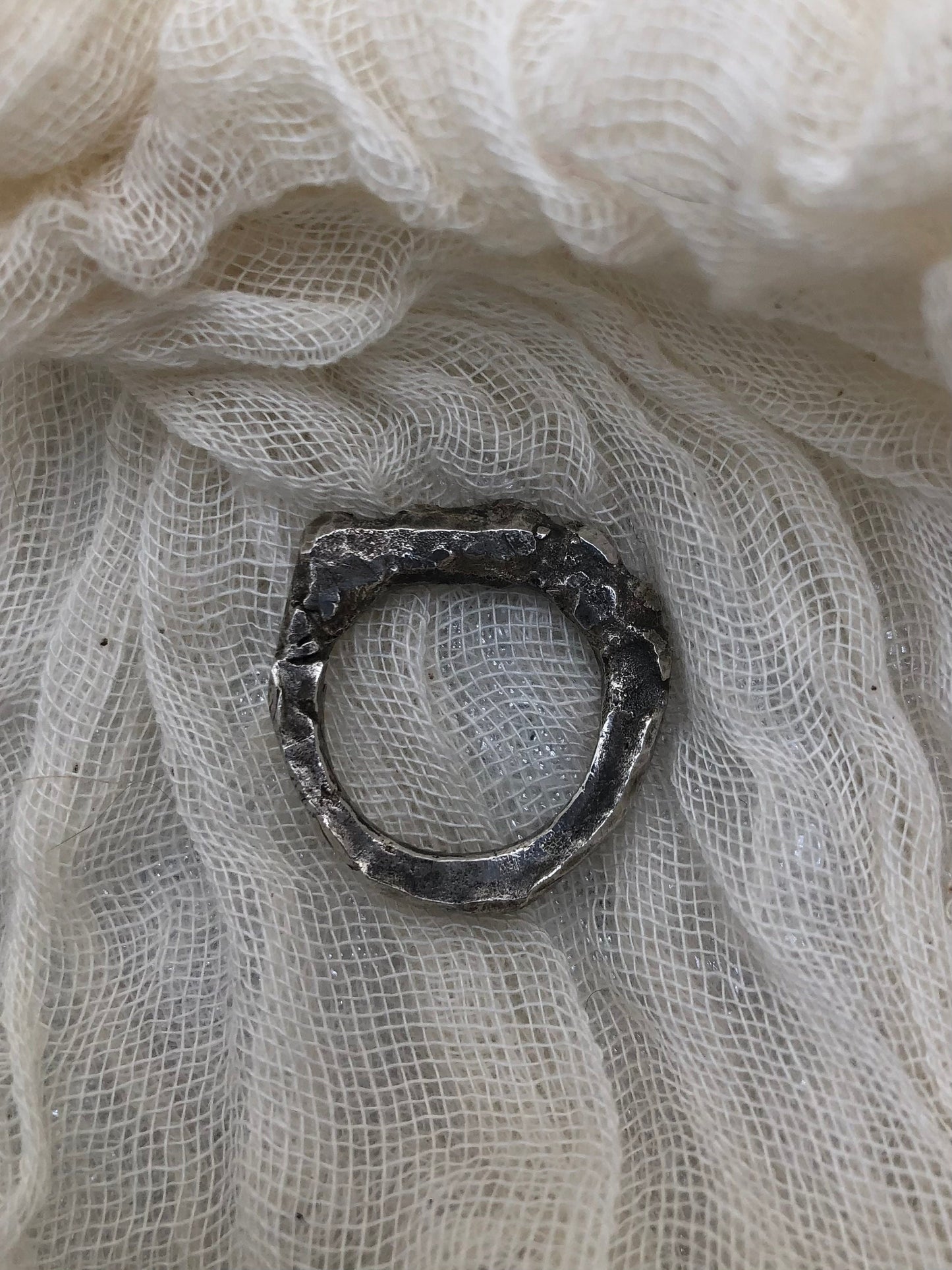 Rock Biter bench cast argentium silver ring